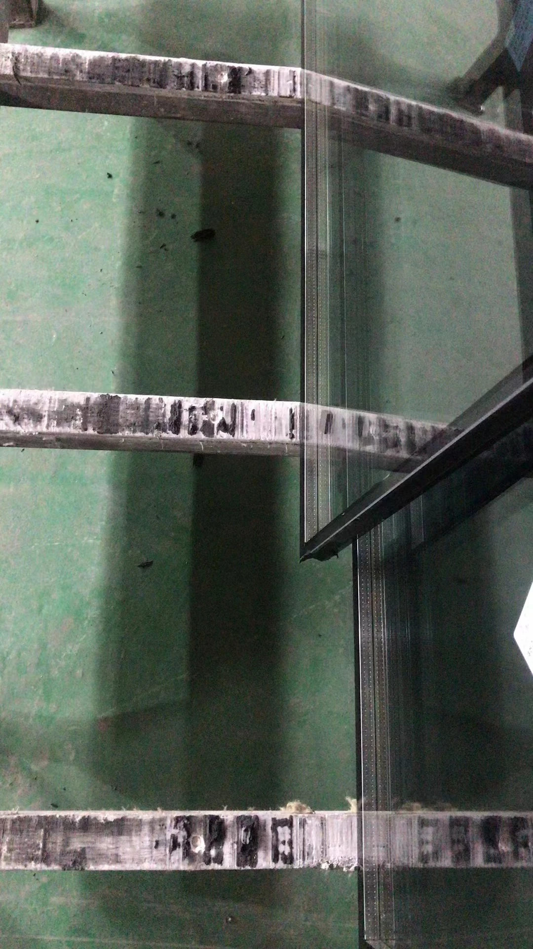 Adhesion of sealant to wooden strips before complete curing.