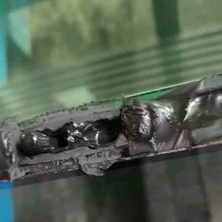 A sealant remains uncured inside a cut-open sample.