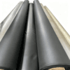 Multiple large rolls of black EVA interlayer film stored in an industrial facility.